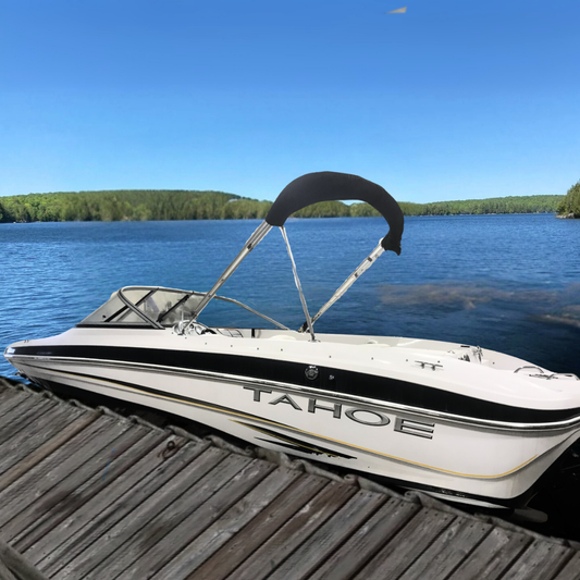 Bowrider boat docked in a lake blue skies
