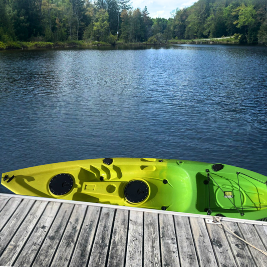 A yellow and green kayak docked in a lake